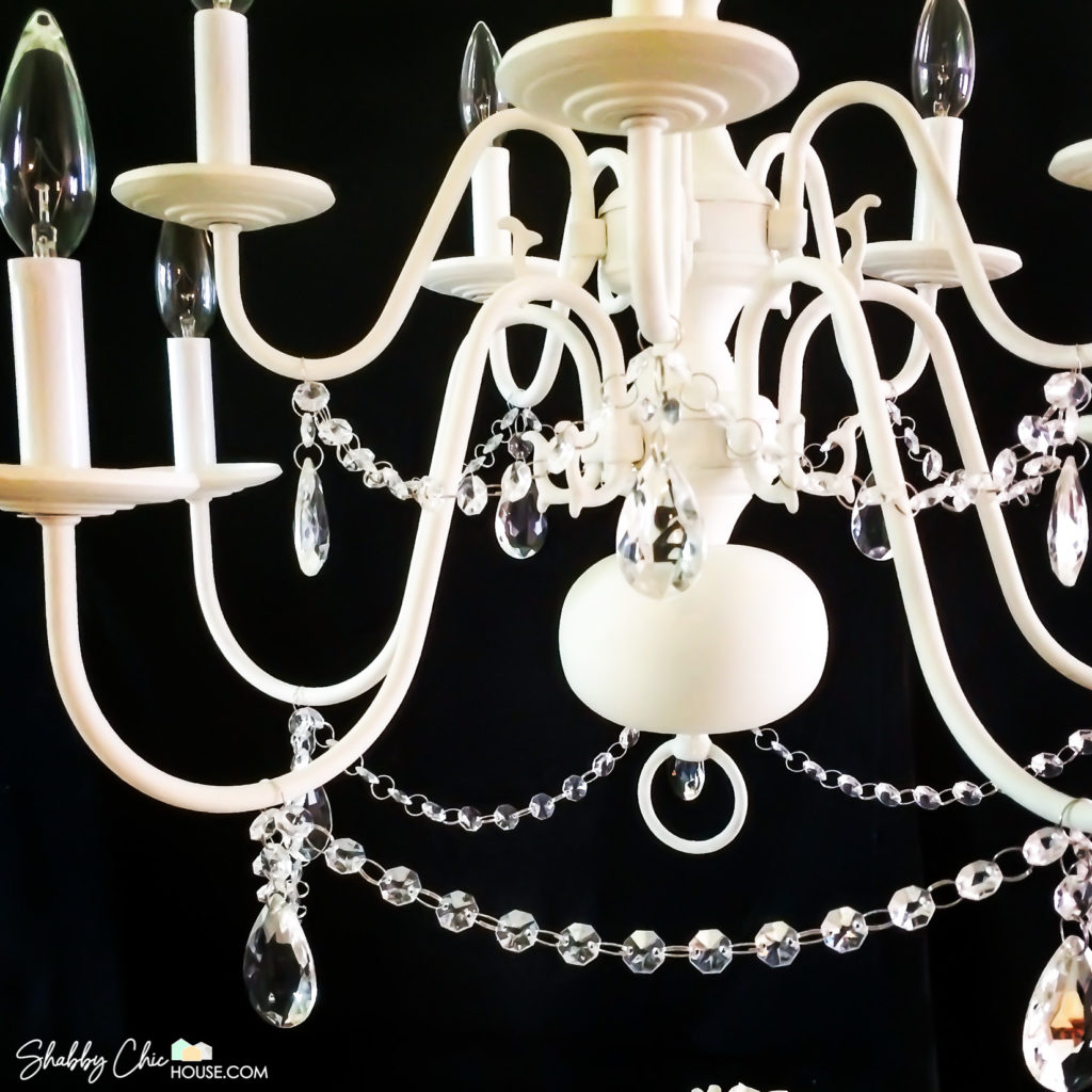 Close-up on DIY White Chalk Paint Chandelier with Crystals