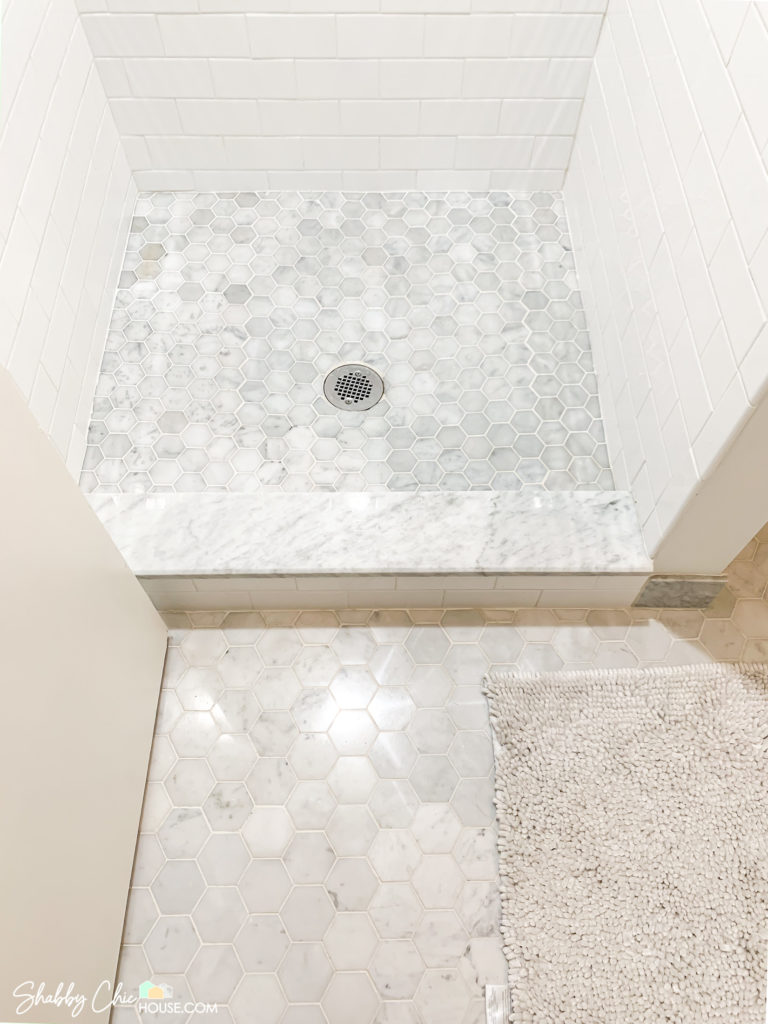Small Bathroom Remodel showing 2" hexagon Italian Carrara tile for shower floor, 3" x 6" white subway tiles for shower walls, Italian Carrara Shower curb & 3" hexagon Italian Carrara tiles for Bathroom Floor