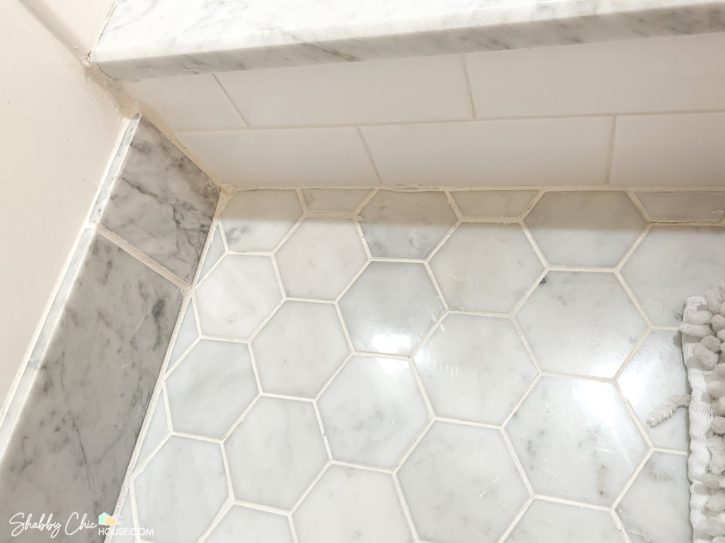 White Tile Grout between Italian Carrara marble and Subway Tile after being cleaned and refreshed