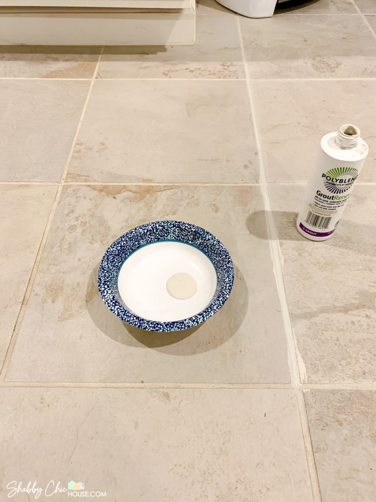 Tile Floor with dirty and clean grout lines and a Polyblend grout renew bottle