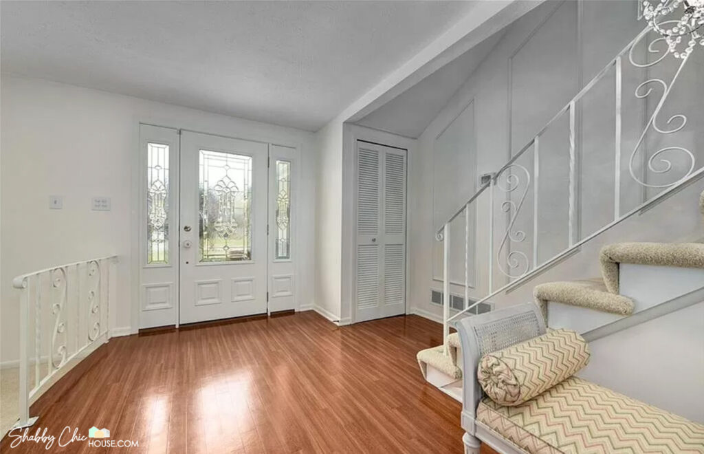 Front door area that was a bold pink color painted white to improve appeal with prospect home buyers