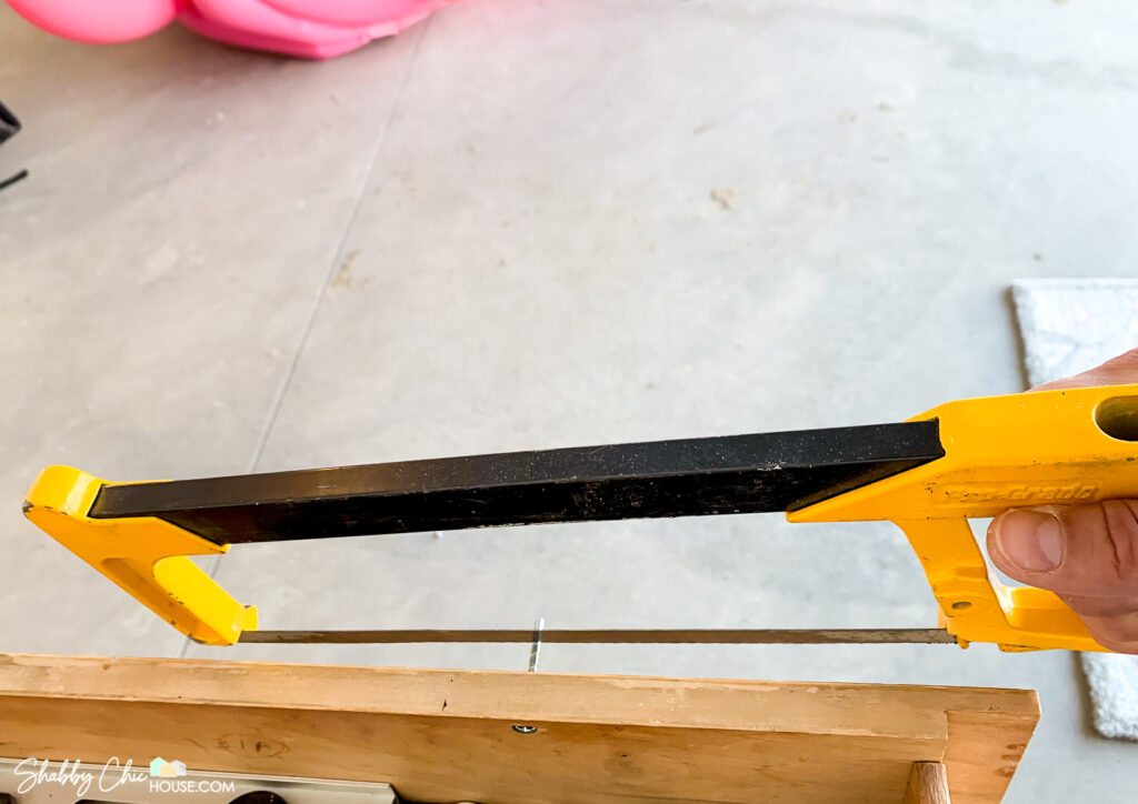 hacksaw cutting cabinet hardware screws to size