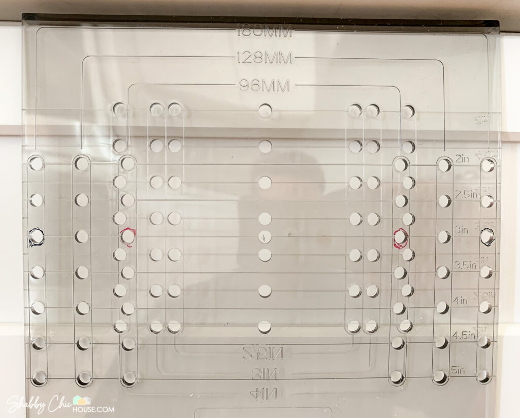 close up of cabinet hardware template showing 96MM, 128MM and 160MM templates