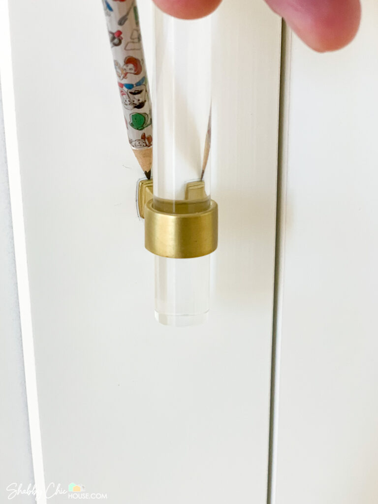 pencil marking drilling area for installation of cabinet handles