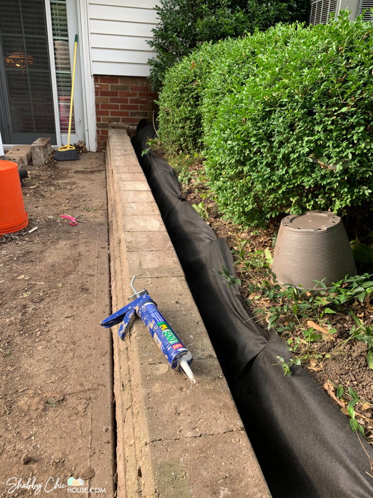 retaining wall that has been rebuilt to restore a patio to prepare a home for sale.