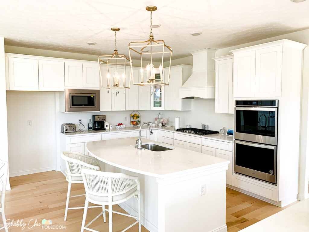 Home Improvement Project - Kitchen with quartz countertops and white shaker cabinets prior to installing cabinet handles