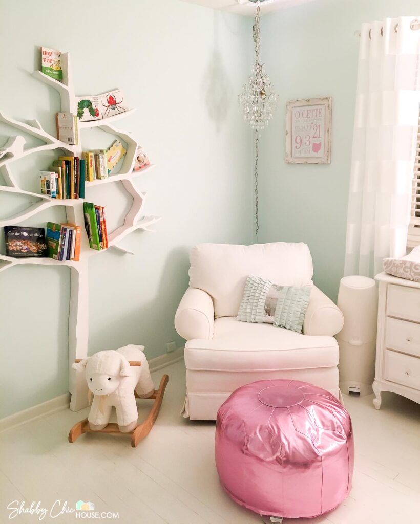 Child's Room with white hardwood floors, tree shaped book shelf, rocking horse and rocking chair