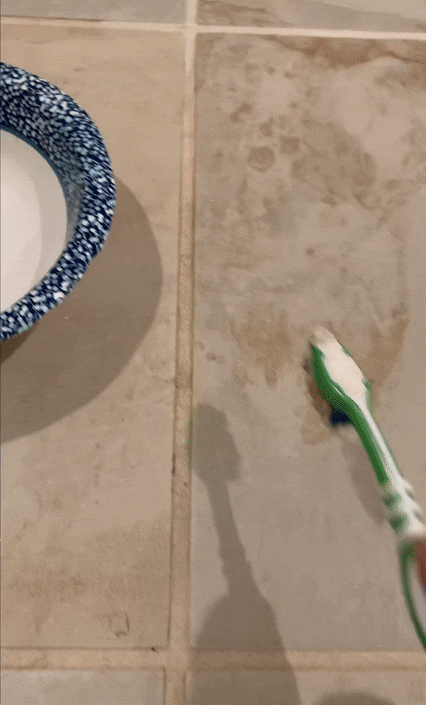 GIF showing cleaning and refreshing of grout tile with a toothbrush and Polyblend Grout Renew