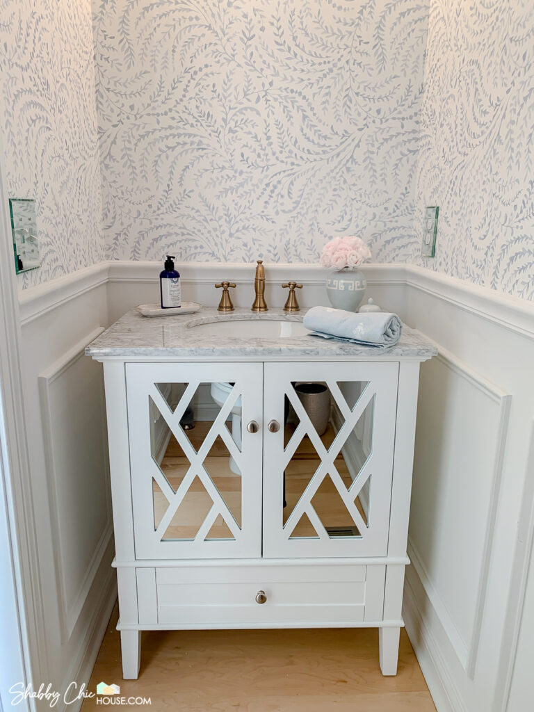 Photo of vanity and wallpaper after chair rail