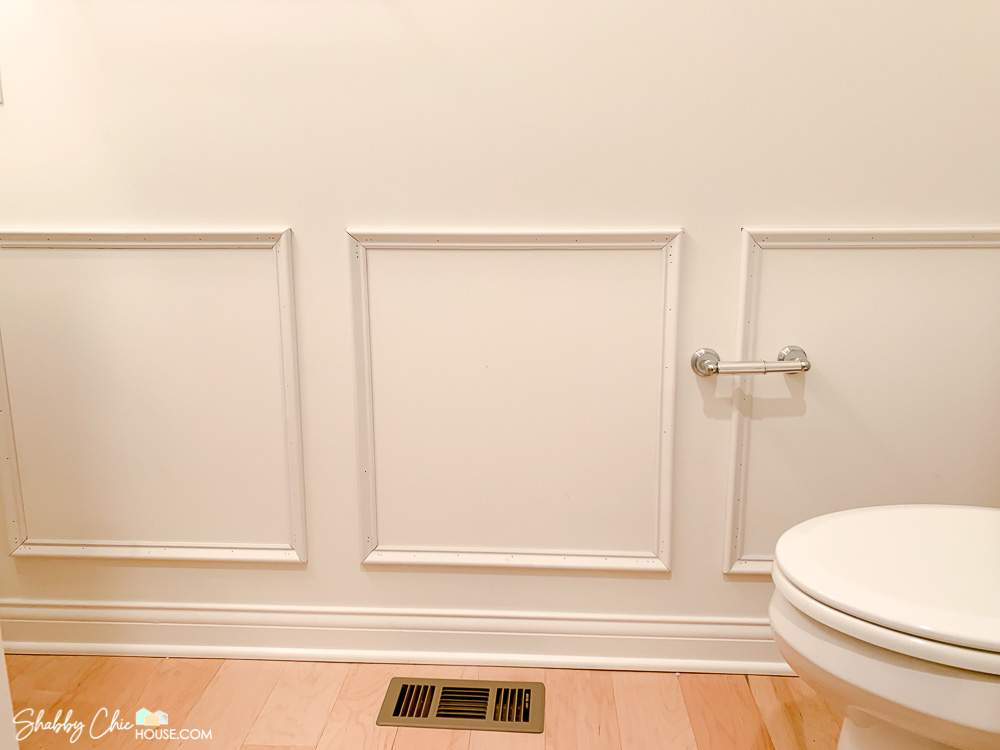 three wainscoting boxes that have been installed prior to wallpaper and chair rail.