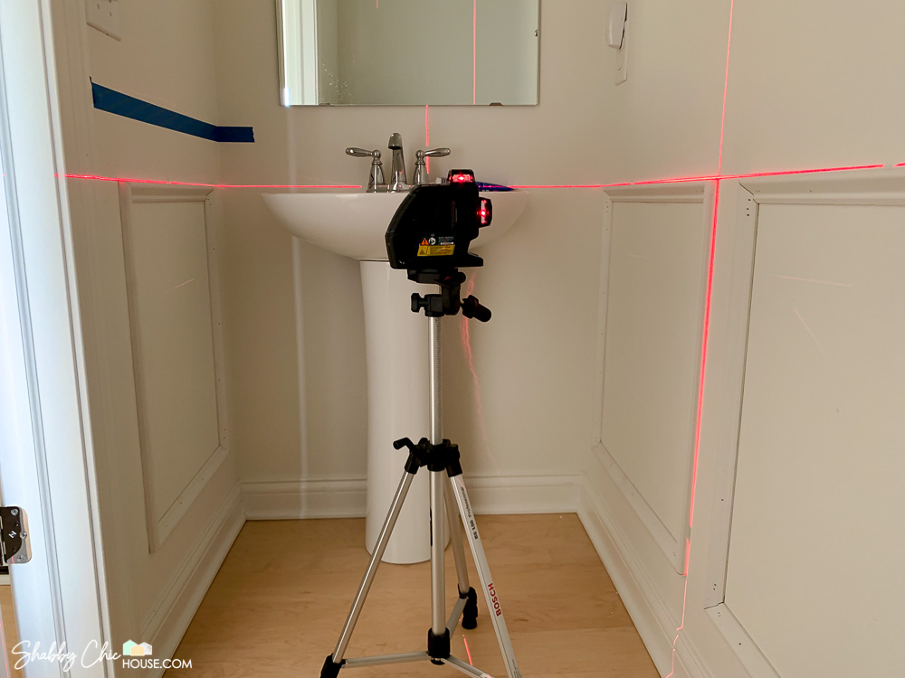 Bosch three plane laser level showing two of the planes used to install wainscoting in a bathroom.
