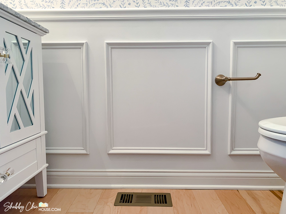 Final shot of wainscoting boxes on the wall after they have been sanded and painted.