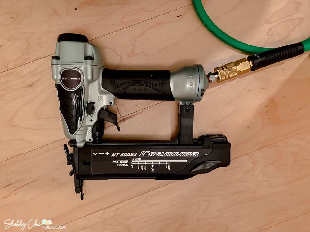 Close-up of a 18 Gauge Metabo HPT brad nailer used for wainscoting.