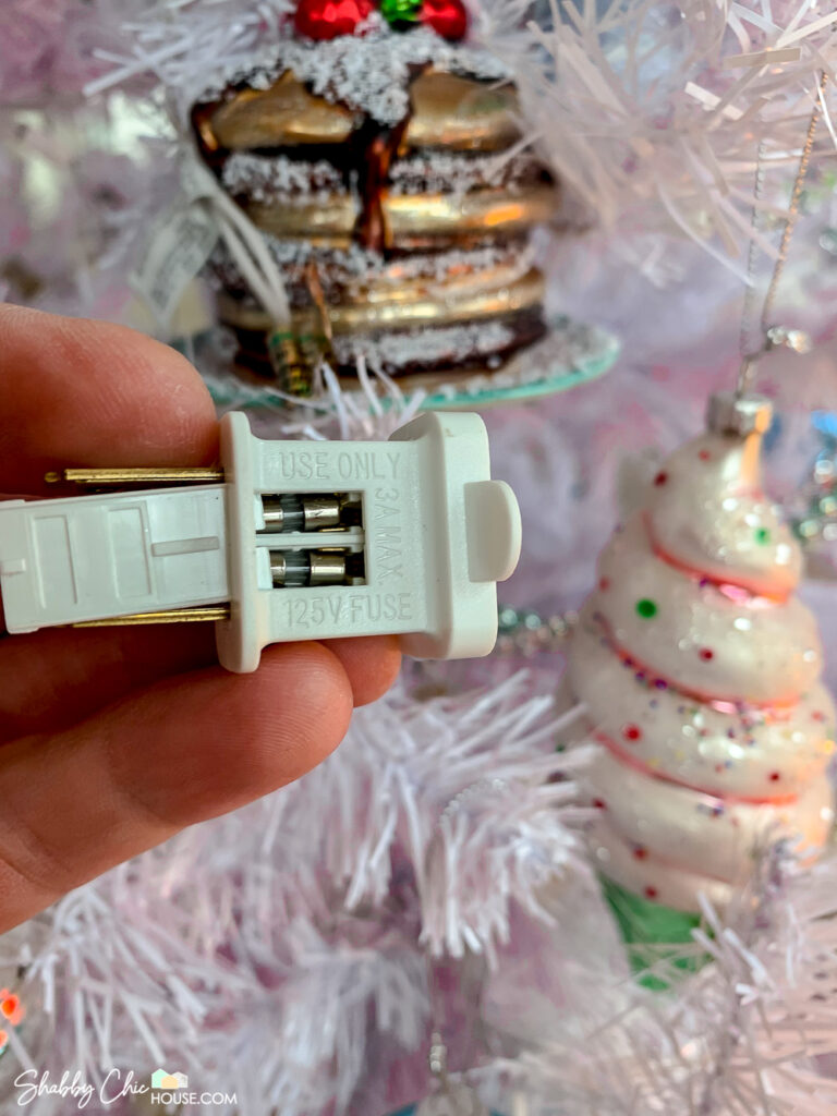 Picture of two 3A 125V fuses in a Christmas Tree light plug for a blog post on how to fix a Christmas Trees lights.