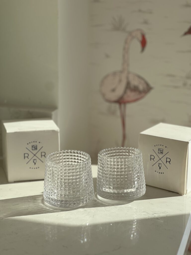 The Rocks N' Roses spinning whiskey glasses